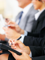 delegates making notes at a
business conference